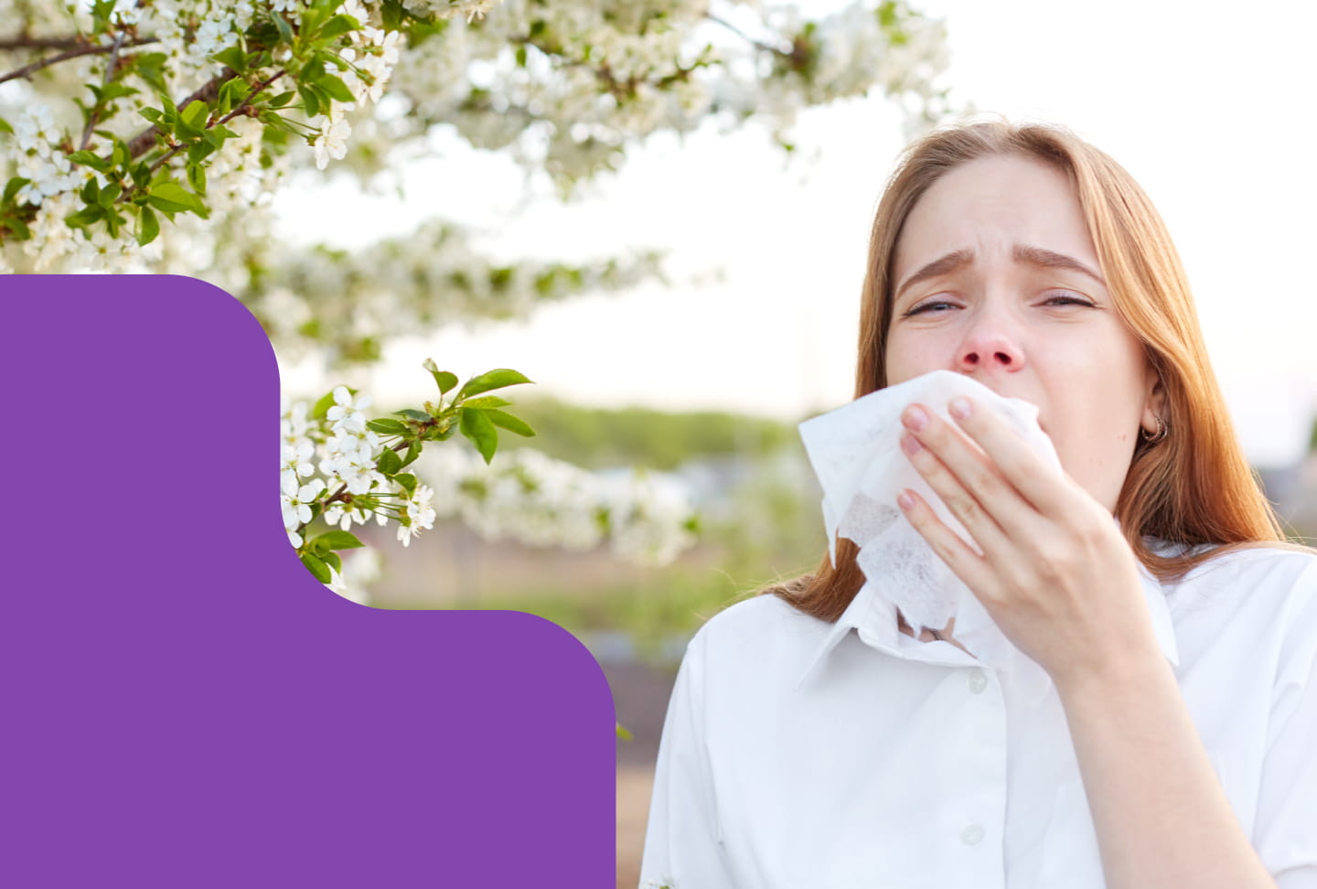 Woman sneezing.