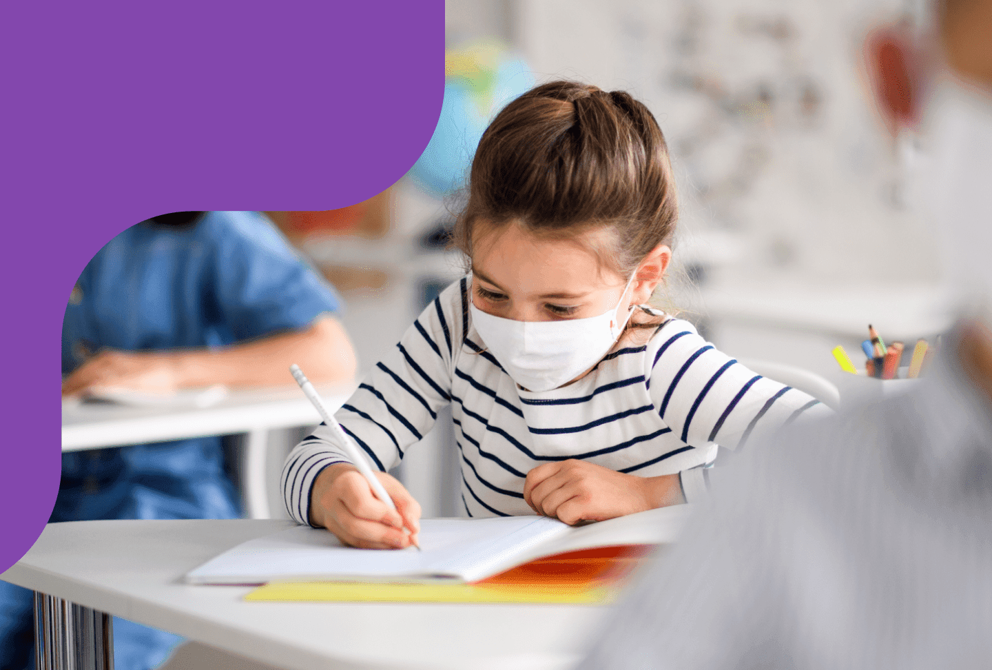 Girl using mask in the classroom.