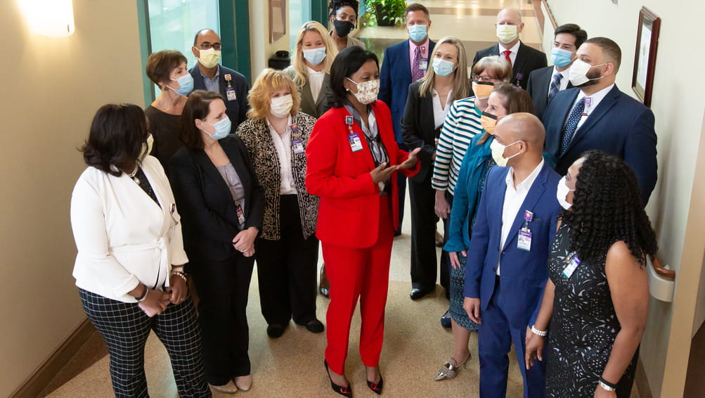 Image of Wellstar executive leadership team speaking in the hallway at Kennestone Emergency Department