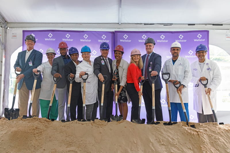 People with shovels at groundbreaking